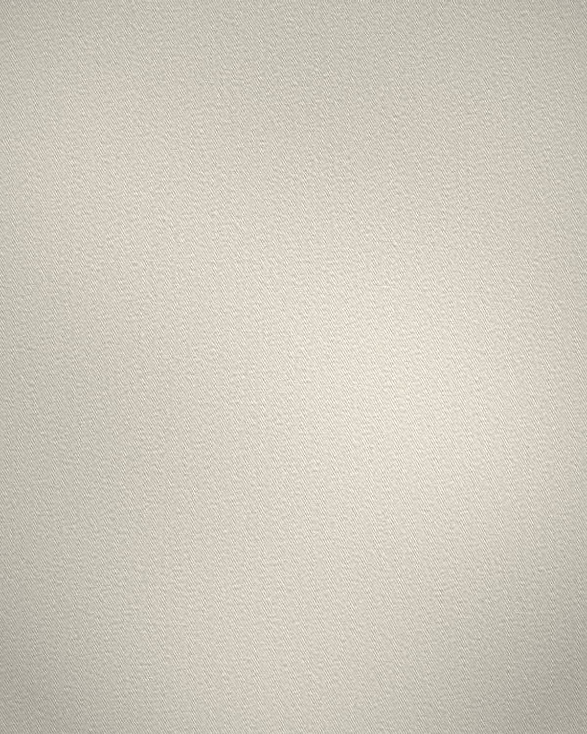 Close-up of soft brushed white cotton, its twill catching a low light