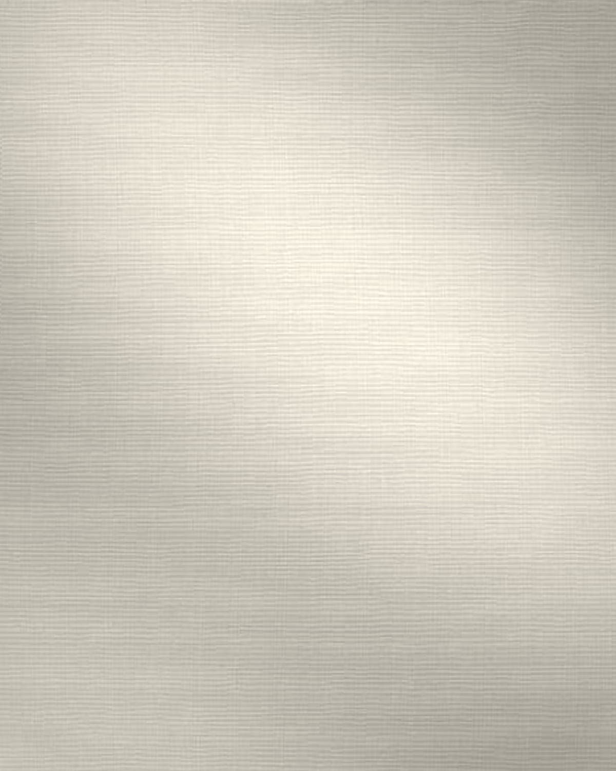 Close-up of plain white cotton canvas folded gently in the light
